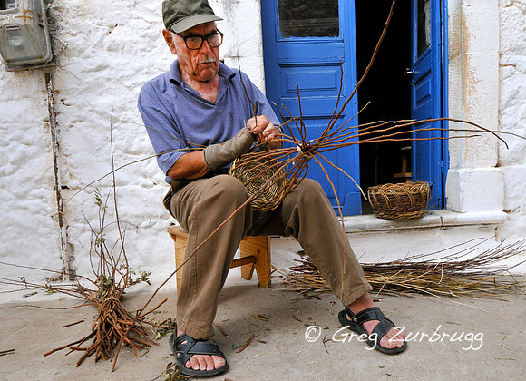 Neighbor man #2 working with his one good hand.