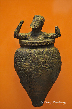 Eurystheus, King of Agros, hiding in fear in a storage jar when Heracles returned with the Erymanthian Boar.