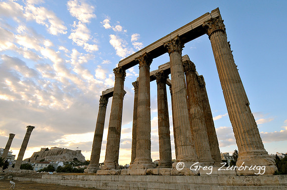 The Temple of the Olympian Zeus with the Acropolis in the background.  This temple was the largest in Greece, even bigger than the Parthenon.